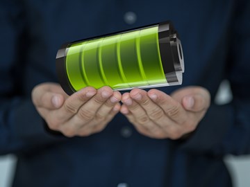 Hände halten neon-grünes Element Hände halten neon-grünes Element